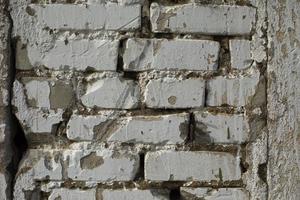 Brick wall white color. Old wall. White paint. photo