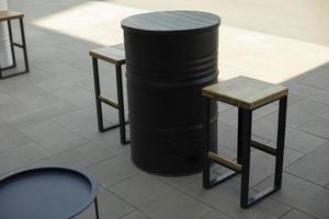 Barrel table. Seats and outdoor table. Place to eat. photo