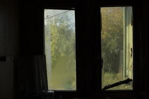 Dark window in room. Old window in interior. Details of room. photo