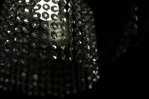 Chandelier in room. Crystal chandelier in interior. Light in dark room. photo