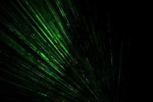 Laser beams in dark. Green rays on black background. Light music bright color. photo
