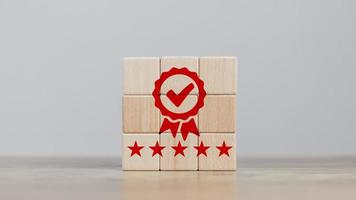 certification and quality concept cube wood aligned icon showing quality assurance certificate  organization must have a certificate  confidence in good service. create satisfaction for customers photo