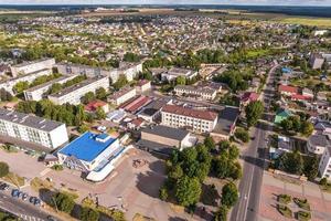 aerial panoramic view from a great height of a small provincial town with a private sector and high-rise apartment buildings photo