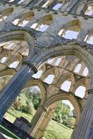 Archs at Rievaulx Abbey ruins in North York moors national Park, Yorkshire United Kingdom photo