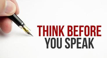 think before you think words on white paper and pen photo