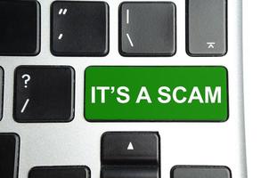 green keyboard button with word scam. Business concept photo