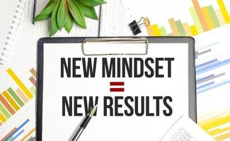 New Mindset - New Results on paper tablet and charts photo