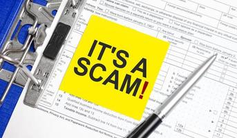 it is a scam on white paper with tax forms photo