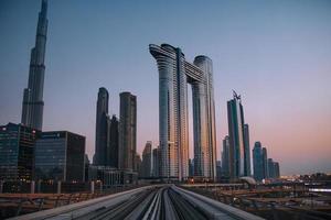 Dubai, UAE, 2022 - railway view with stunning unique Dubai skyscrapers panorama background photo