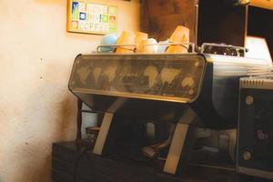 Dubai, UAE, 2022 - old vintage coffee machine on counter in cafe. Coffee museum in Dubai creek. photo