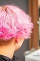 Pink hairstyle of young woman photo