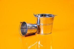 empty glass empty jar empty ice bucket on orange background photo