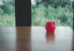 piggy bank on table with space photo