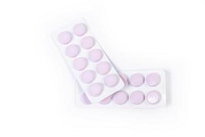 Medical pill blister on isolated white background with reflection photo