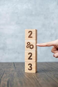 2023 block with gear icon. Business Process, Team, teamwork, Goal, Target, Resolution, strategy, plan, Action, motivation, change, brainstorm and New Year start concepts photo