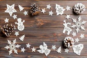 Top view of Christmas decorations and toys on wooden background. Copy space. Empty place for your design. New Year concept photo