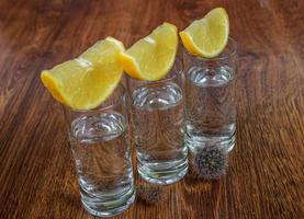 Tequila shot with lemon photo