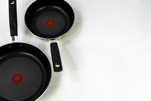 set of cooking pans on white background, mexico photo