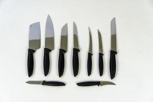 Sharp large kitchen knife on a dark surface, white background mexico photo