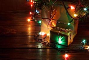 Gifts under the Christmas tree lights background photo