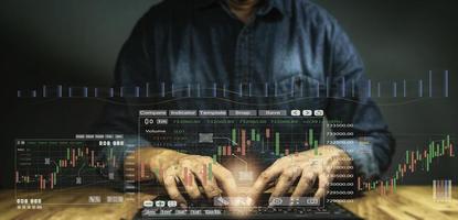 Hand of Businessman or merchant showing off virtual hologram stock. Buying and selling volume matters It is the heart of the pressure to make the graph move. with increased copy space photo