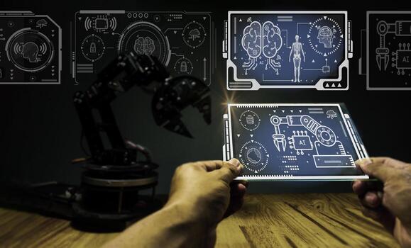 Engineers use their fingers to operate on the displayed image. In order to divide the control of automatic robotic arms in AI technology, AI technology is what is used in the world  in the future. photo
