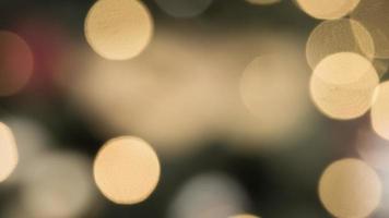 abstract blurred bokeh light with warm tone color background concept. photo