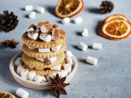 Marshmallow brownies with chocolate on the cookies in layers on concrete background. Copy space. Christmas layout, photo