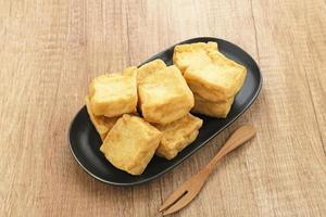 Tahu Goreng or Fried Tofu, Indonesia traditional food, made from fermented soybean extract. photo