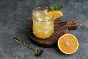 Orange juice in glass, cold pressed juice photo