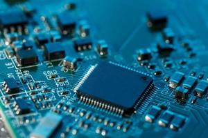 Electronic circuit board close up. Processor, chips and capacitors. photo