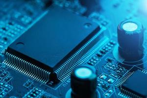 Electronic circuit board close up. Processor, chips and capacitors. photo