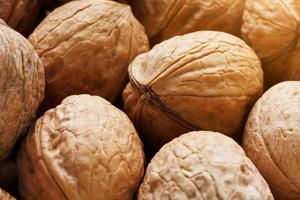 Natural Walnuts in shell background dramatic contrast photo