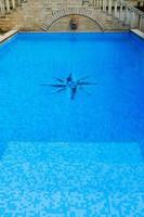 surface of blue swimming pool,background of water in swimming pool. photo