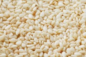 White sesame seeds background. Useful seeds for cooking photo