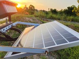 Landscape view of solar cells reflecting down the sun to produce renewable energy. photo