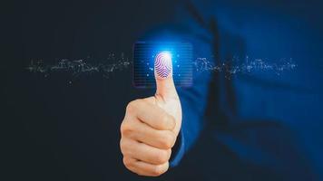 Virtual fingerprint thumbs up to scan biometric identities and fingerprint access passwords for technological security concepts. Digital transformation change management internet of things. photo
