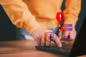 Man typing login and password, cyber security concept, Secure encryption and access to the user's private information to access the Internet. exclamation mark. photo