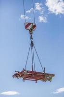 Industrial area. Unloading by the crane of the production equipmentin Graz, Austria. photo