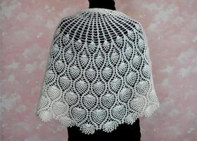 White downy shawl on shoulders. Orenburg downy shawl photo