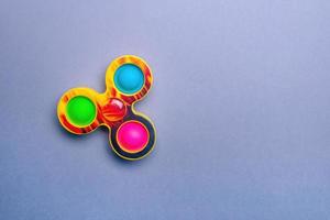 Bright spinner and simple dimple. Fashionable and modern antistress toy for children and adults. photo