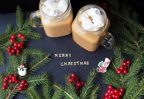 marshmellou hot cocoa trees in the background. The inscription Merry Christmas photo