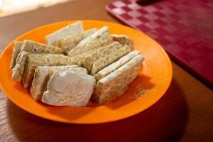 tempeh in a plastic container that is placed on the table photo