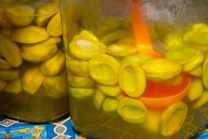 pickles mango and pineapple placed in a jar, selling street vendors photo