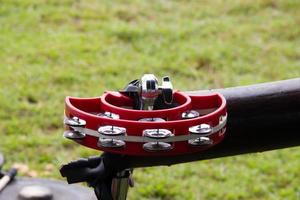 red tambourine on green grass background on celebration celebration photo