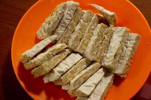 tempeh in a plastic container that is placed on the table photo