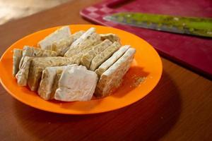 tempeh in a plastic container that is placed on the table photo