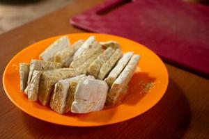 tempeh in a plastic container that is placed on the table photo