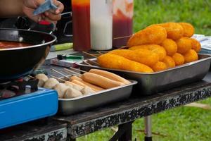 fried meatballs, grilled meatballs, fried sausages sold by street vendors photo