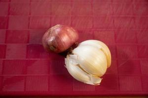 Garlic, onion and ginger placed on the table are brown photo